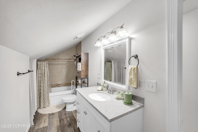 full bathroom featuring toilet, vaulted ceiling, shower / bath combo with shower curtain, wood finished floors, and vanity