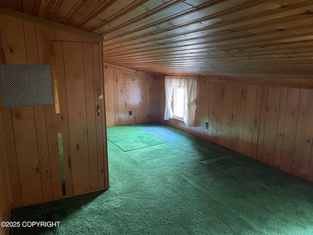 additional living space featuring wooden ceiling, wooden walls, and carpet floors