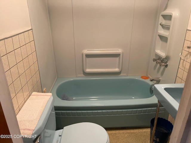 bathroom with toilet and tub / shower combination
