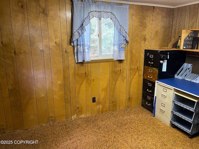 office with crown molding, carpet, and wood walls