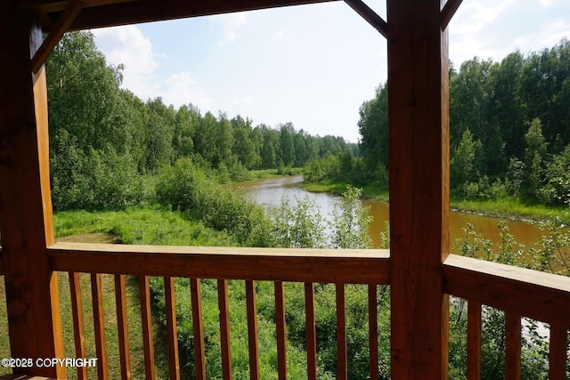 water view featuring a forest view