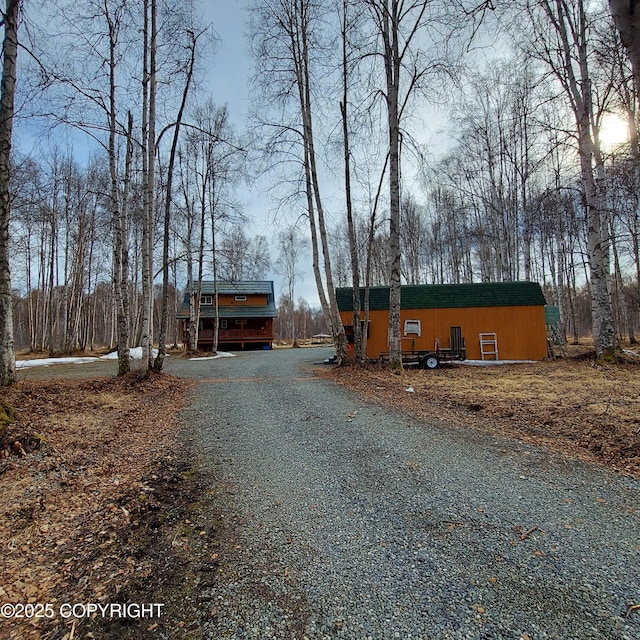 view of road featuring gravel driveway