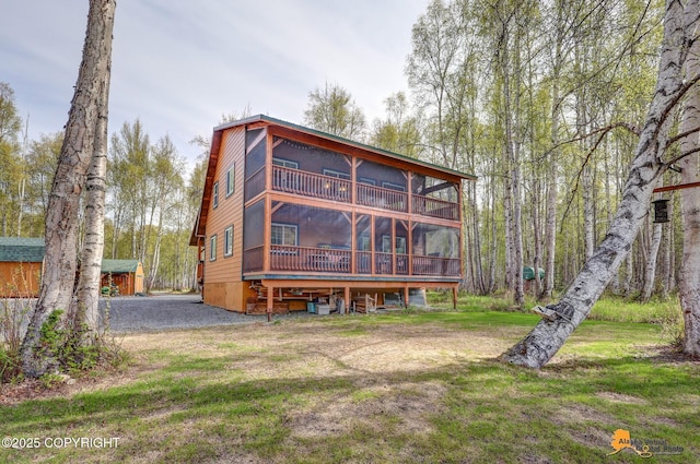 49635 S Hunter Dr, Willow, AK 99688 - rear view of property featuring a sunroom and a yard