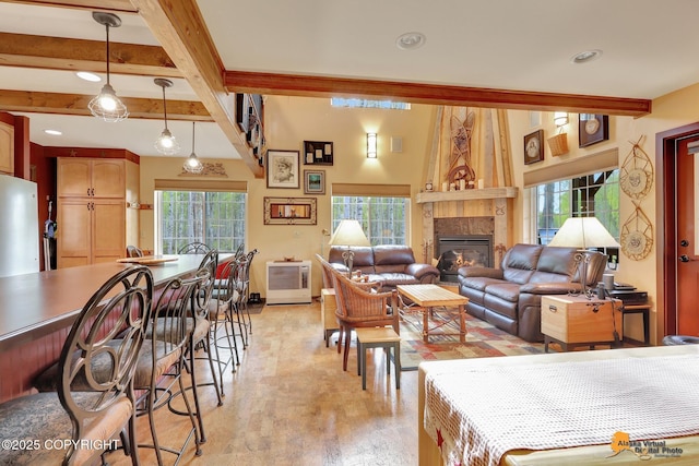49635 S Hunter Dr, Willow, AK 99688 - living area featuring beamed ceiling, light wood-type flooring, a glass covered fireplace, and recessed lighting