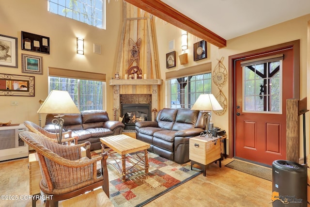 49635 S Hunter Dr, Willow, AK 99688 - living room featuring healthy amount of natural light, a high ceiling, a large fireplace, light wood-style flooring, and beam ceiling