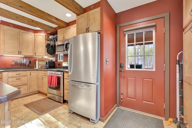 49635 S Hunter Dr, Willow, AK 99688 - kitchen with appliances with stainless steel finishes, light brown cabinetry, beamed ceiling, dark countertops, and light floors