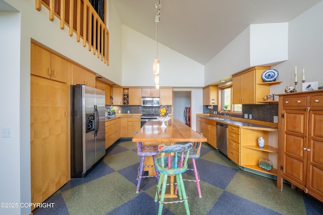 2435 Paradise Pl, Homer, AK 99603 - kitchen with stainless steel appliances, open shelves, dark flooring, a sink, and high vaulted ceiling