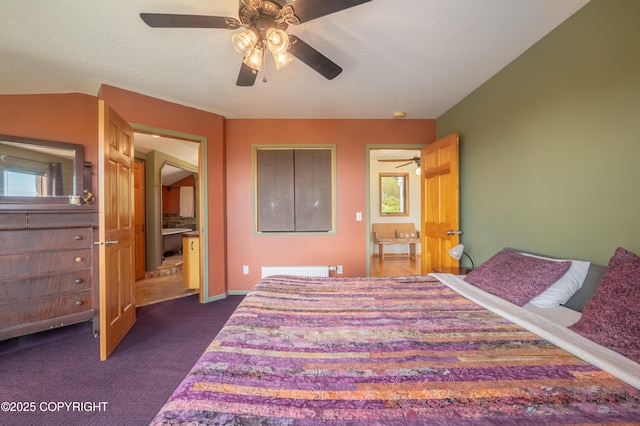 2435 Paradise Pl, Homer, AK 99603 - bedroom with dark colored carpet, a ceiling fan, radiator, and baseboards