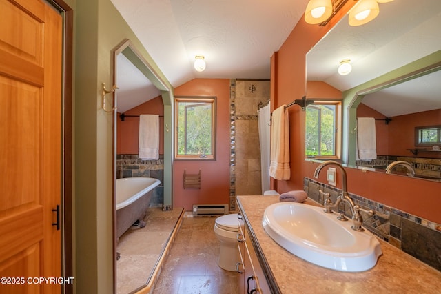 2435 Paradise Pl, Homer, AK 99603 - full bath with vaulted ceiling, vanity, a freestanding tub, toilet, and curtained shower