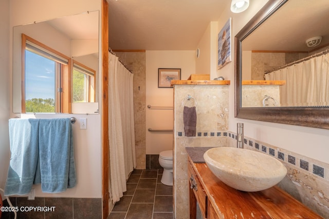2435 Paradise Pl, Homer, AK 99603 - bathroom with toilet, vanity, tile patterned floors, and a shower with shower curtain