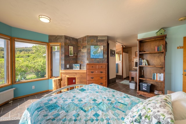 2435 Paradise Pl, Homer, AK 99603 - bedroom featuring radiator, baseboards, and tile patterned floors