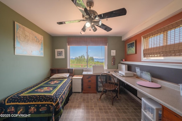 2435 Paradise Pl, Homer, AK 99603 - bedroom featuring multiple windows, an office area, and ceiling fan