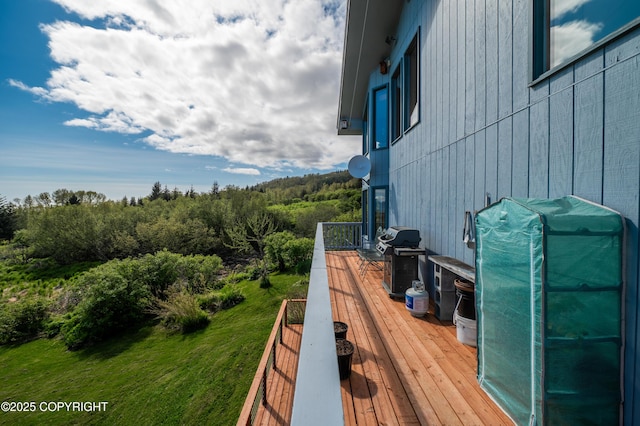 2435 Paradise Pl, Homer, AK 99603 - deck with a grill and a wooded view