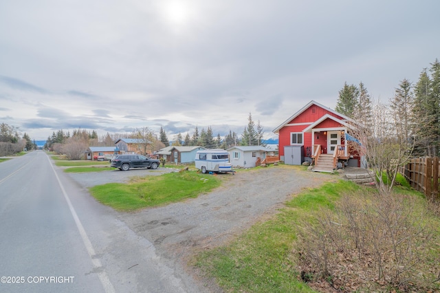 437 W Fairview Ave, Homer, AK 99603 - view of front of property featuring driveway, fence, and a residential view