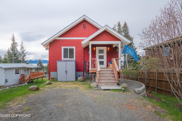 437 W Fairview Ave, Homer, AK 99603 - view of front facade with fence and a deck