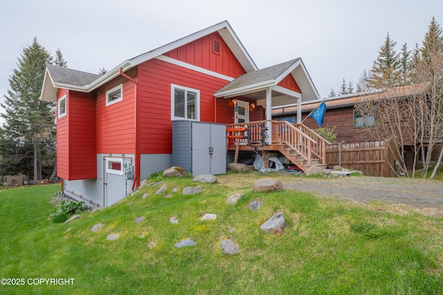 437 W Fairview Ave, Homer, AK 99603 - view of front of property featuring a front yard, stairway, and board and batten siding