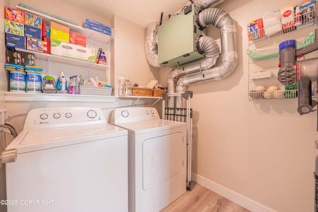 437 W Fairview Ave, Homer, AK 99603 - washroom with washing machine and clothes dryer, wood finished floors, and baseboards