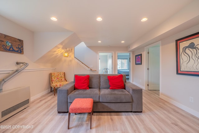 437 W Fairview Ave, Homer, AK 99603 - living area with wood finished floors, baseboards, recessed lighting, and heating unit