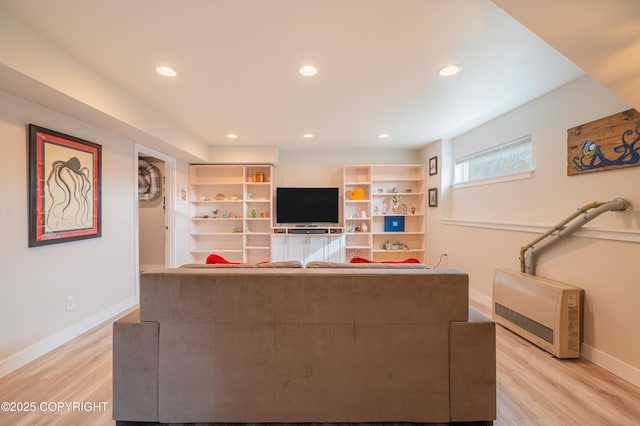 437 W Fairview Ave, Homer, AK 99603 - living room with baseboards, light wood-type flooring, recessed lighting, and heating unit