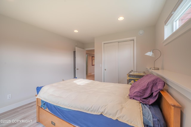 437 W Fairview Ave, Homer, AK 99603 - bedroom featuring baseboards, a closet, light wood-style floors, and recessed lighting