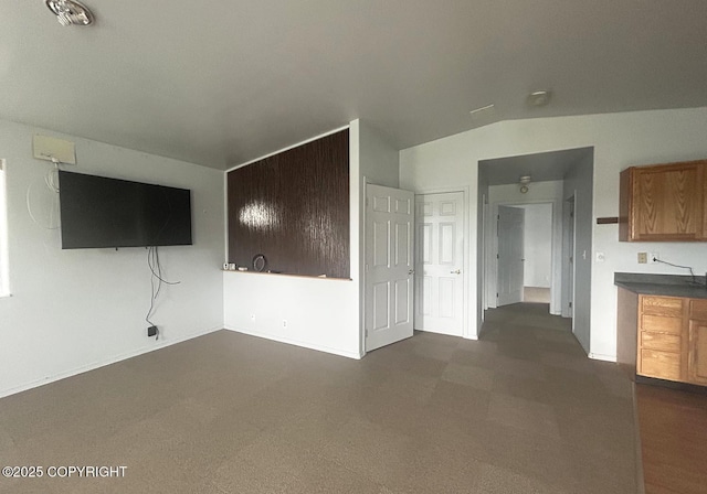 3698 Poppy Cir, Homer, AK 99603 - unfurnished living room with lofted ceiling and baseboards