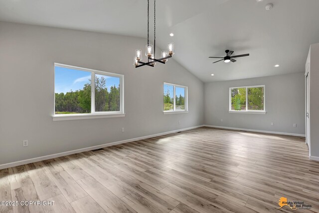 3696 S Alvaro Dr, Wasilla, AK 99654 - spare room featuring ceiling fan, vaulted ceiling, wood finished floors, recessed lighting, and a chandelier