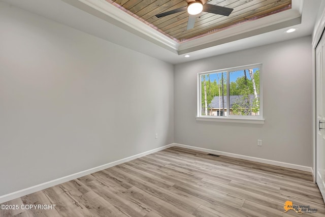 3696 S Alvaro Dr, Wasilla, AK 99654 - empty room featuring a tray ceiling, wood ceiling, recessed lighting, light wood-style floors, and ceiling fan