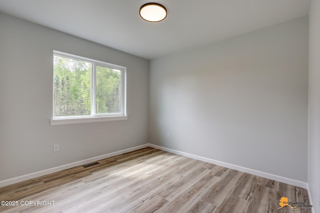 3696 S Alvaro Dr, Wasilla, AK 99654 - unfurnished room with light wood-style flooring and baseboards