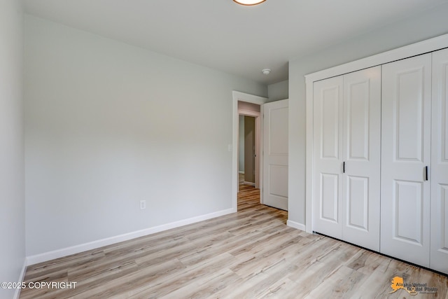3696 S Alvaro Dr, Wasilla, AK 99654 - unfurnished bedroom featuring wood finished floors and a closet