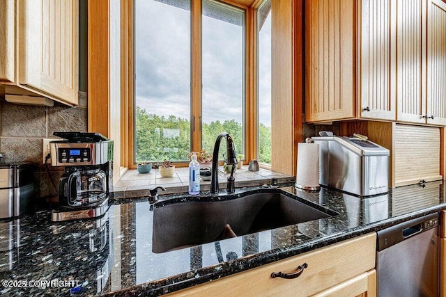 41345 Alan St, Homer, AK 99603 - kitchen featuring stainless steel dishwasher, a sink, backsplash, and dark stone counters
