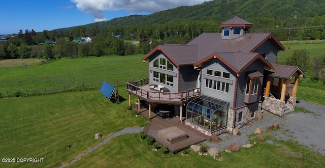 41345 Alan St, Homer, AK 99603 - rear view of property with a lawn, a forest view, stone siding, and a deck