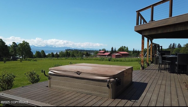 41345 Alan St, Homer, AK 99603 - wooden deck with outdoor dry bar, fence, a hot tub, and a yard
