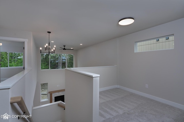 corridor with an upstairs landing, healthy amount of natural light, carpet, baseboards, and recessed lighting