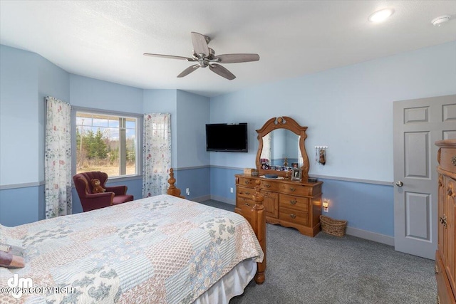 carpeted bedroom with baseboards and ceiling fan