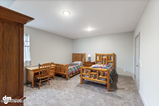 bedroom featuring recessed lighting and light carpet