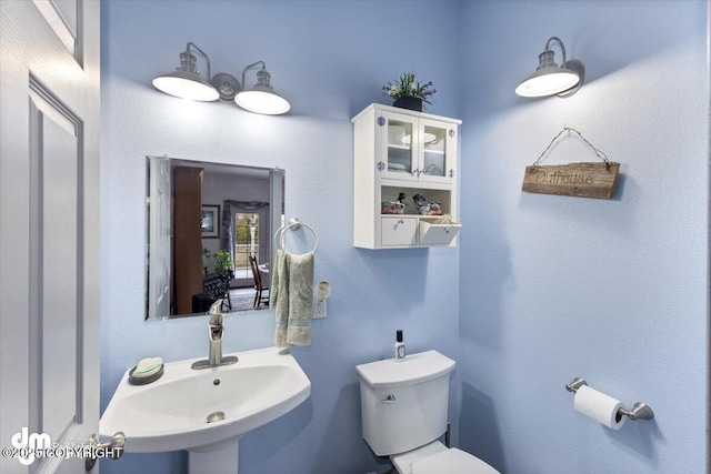 bathroom with a sink and toilet