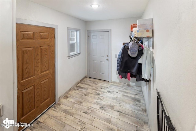 interior space with baseboards and recessed lighting