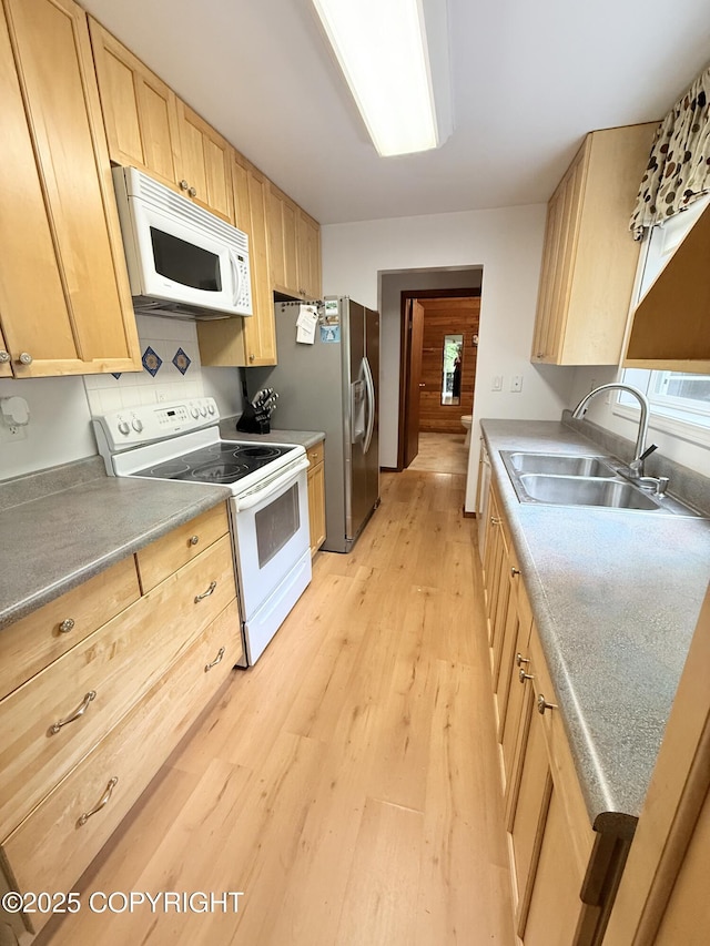 12399 Blackberry Ln, Ketchikan, AK 99901 - kitchen with white appliances, light brown cabinets, and light wood-style floors