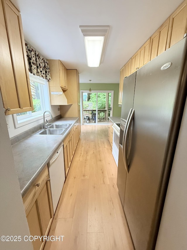 12399 Blackberry Ln, Ketchikan, AK 99901 - kitchen with stainless steel refrigerator with ice dispenser, white dishwasher, light brown cabinetry, light wood finished floors, and healthy amount of natural light