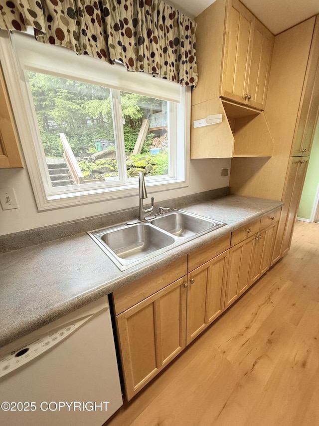 12399 Blackberry Ln, Ketchikan, AK 99901 - kitchen featuring dishwasher, light wood-style flooring, light brown cabinets, and light countertops