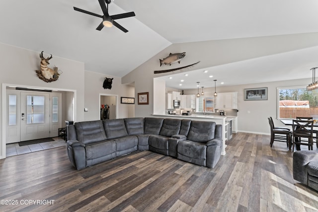 living area featuring recessed lighting, wood finished floors, vaulted ceiling, ceiling fan, and baseboards