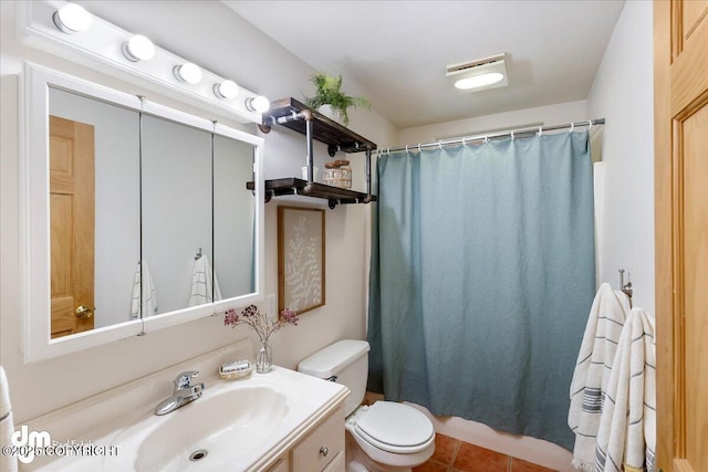bathroom featuring vanity, tile patterned flooring, curtained shower, and toilet