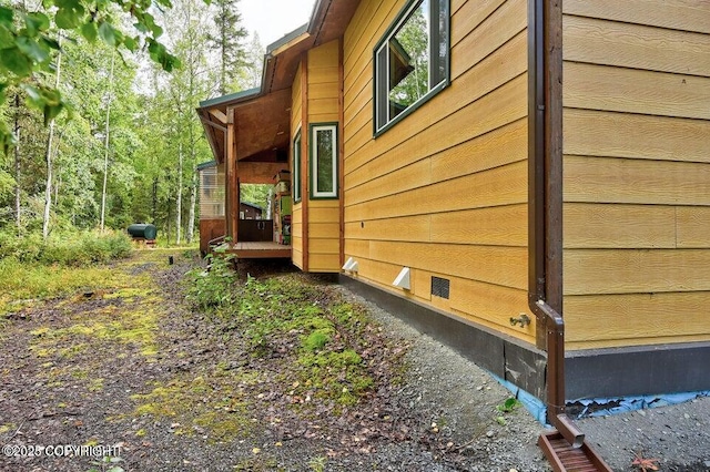 view of home's exterior with a wooden deck