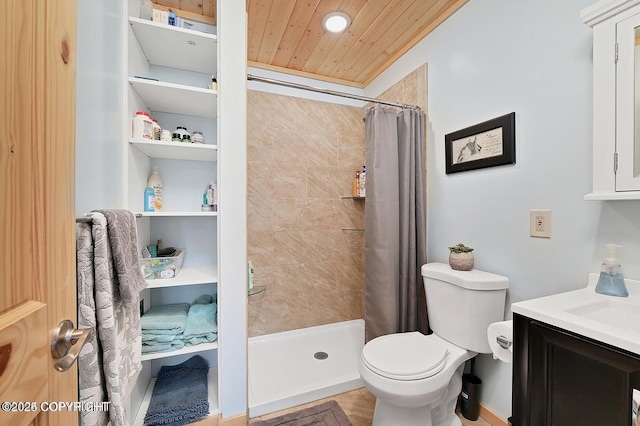 36696 Tammarack St, Soldotna, AK 99669 - bathroom featuring vanity, wooden ceiling, a tile shower, and toilet