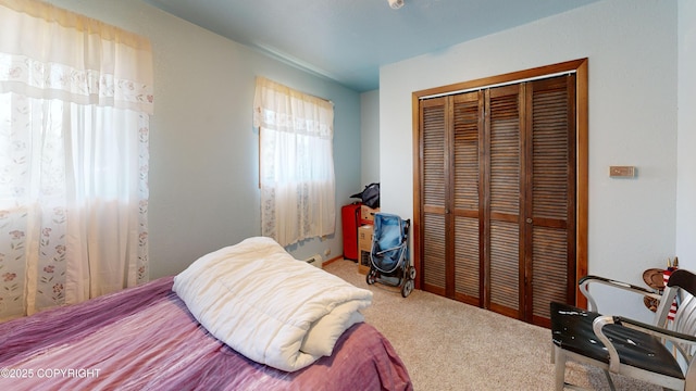 carpeted bedroom featuring a closet