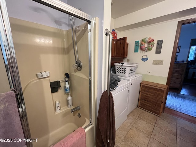 laundry room featuring washing machine and dryer and laundry area