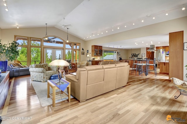 16900 Ransom Ridge Rd, Anchorage, AK 99516 - living room with light wood-style flooring, french doors, and high vaulted ceiling