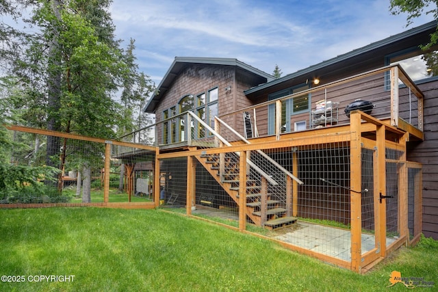 16900 Ransom Ridge Rd, Anchorage, AK 99516 - rear view of house featuring a yard, stairway, and a wooden deck