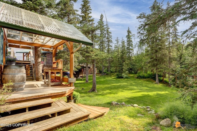 16900 Ransom Ridge Rd, Anchorage, AK 99516 - view of grassy yard with stairway and a wooden deck