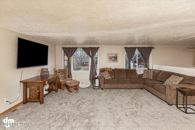 10209 Colville St, Eagle River, AK 99577 - carpeted living room featuring a textured ceiling